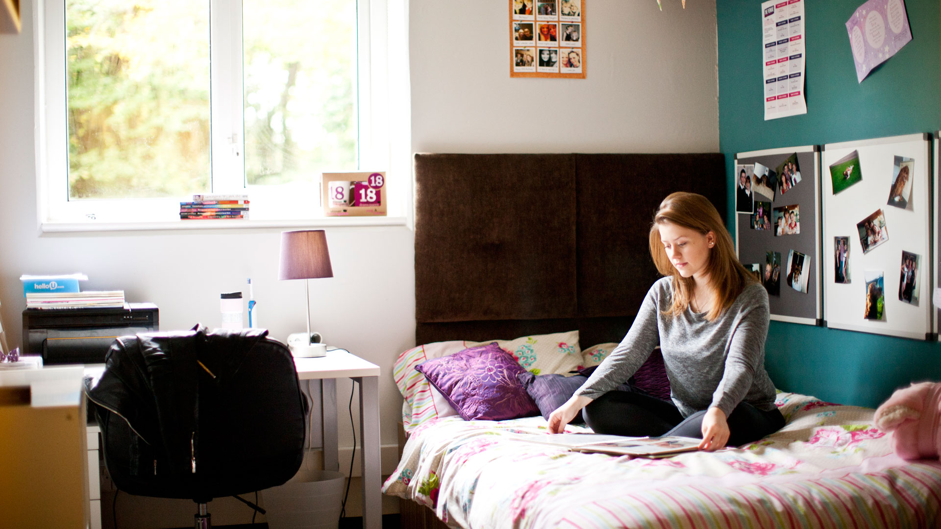 Girl reading a book on her bed
