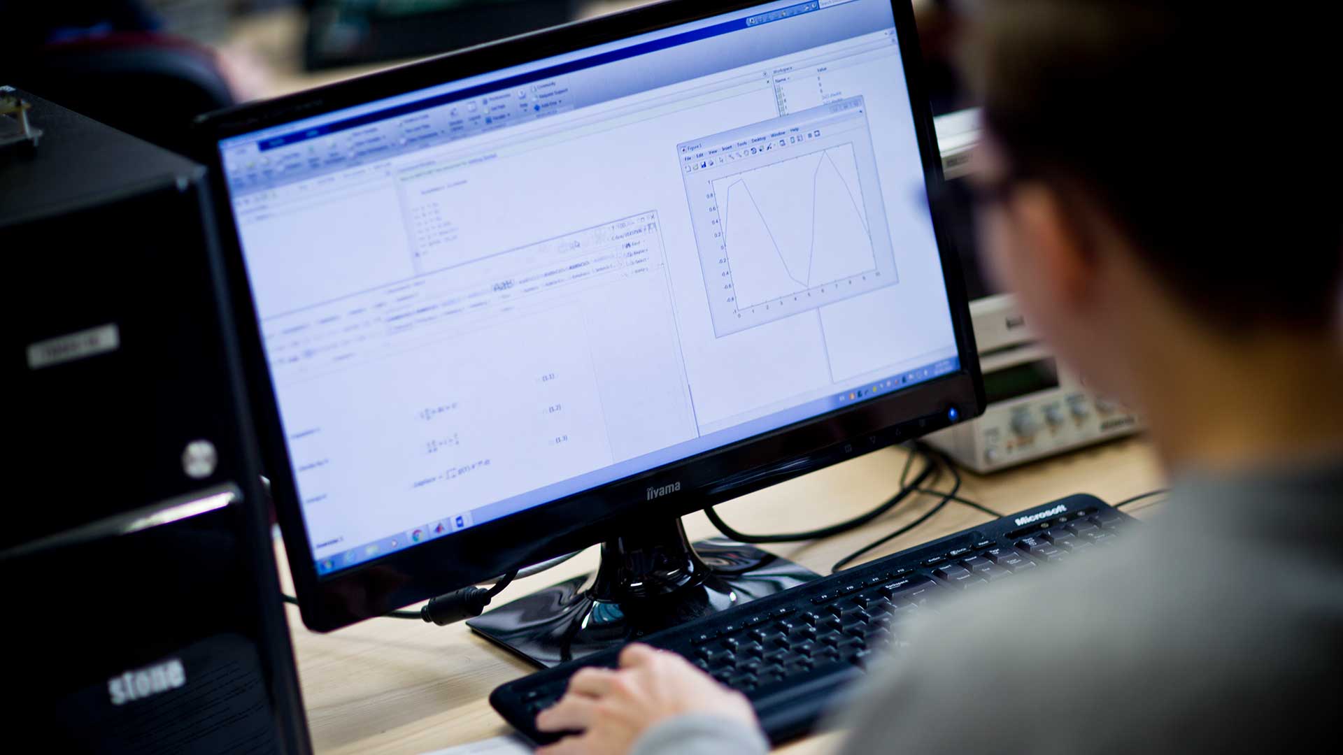 student at a computer screen