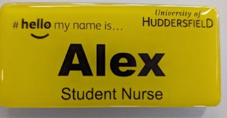 A yellow badge with the name 'Alex' and the title 'Student Nurse', demonstrating the style of badge issues to students with the NHS