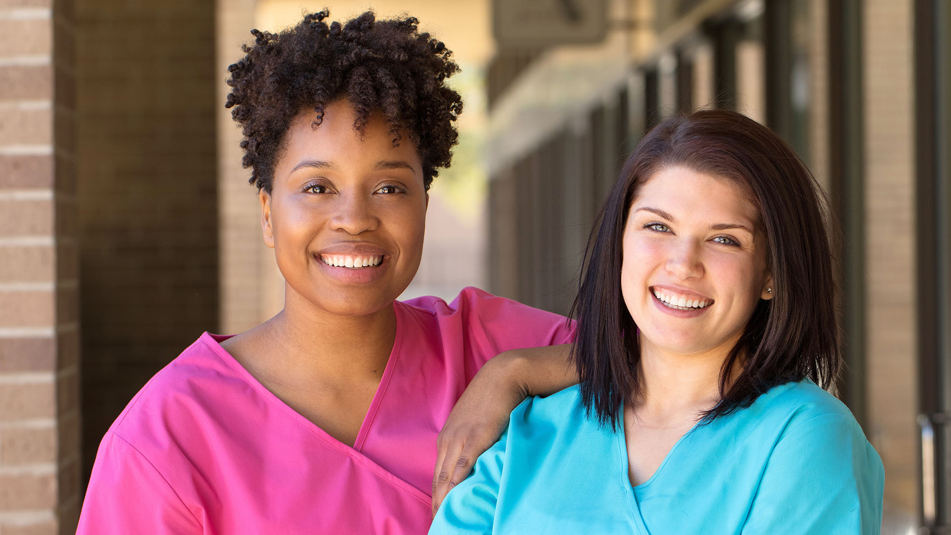 2 nurses smiling