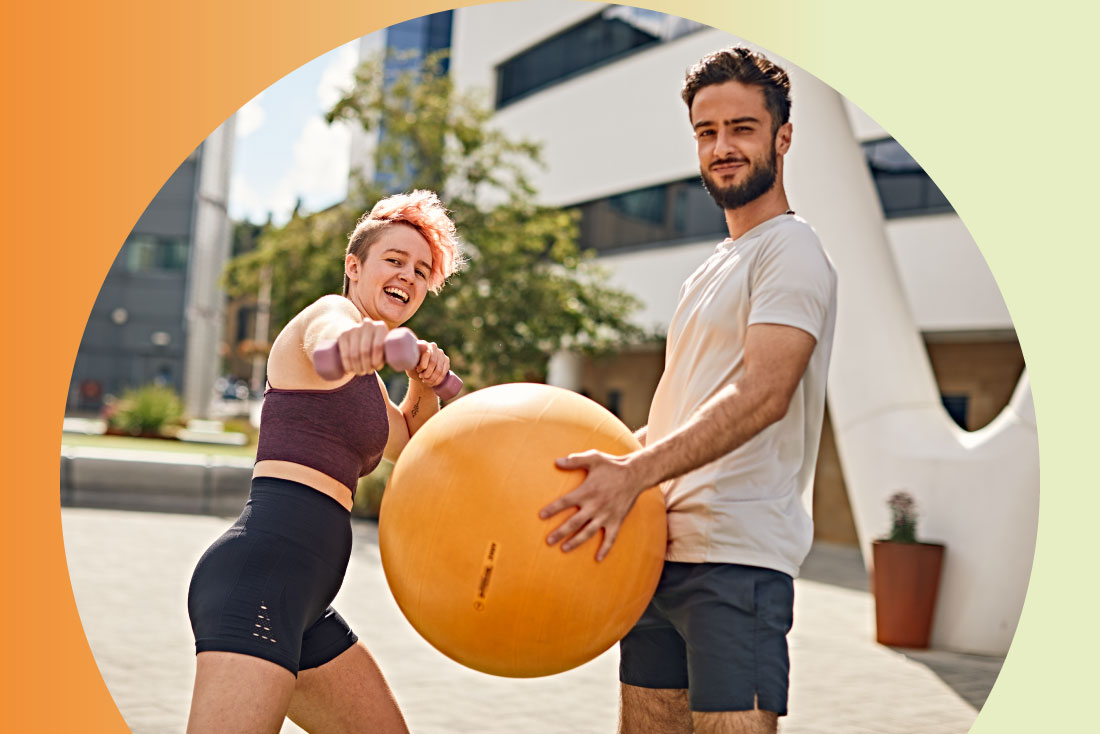Two people outside with workout equipments