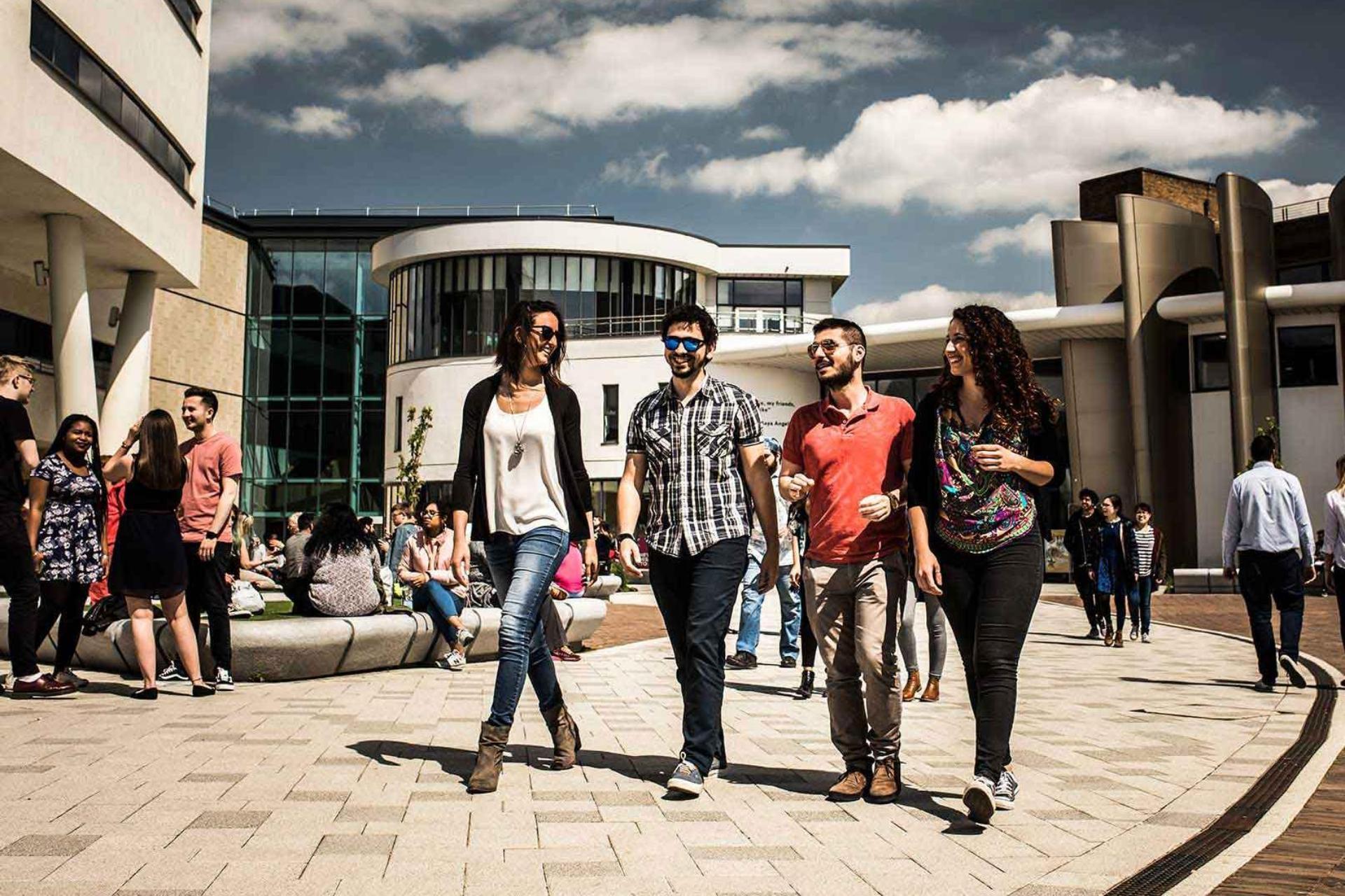 Students walking through the plaza in front of Student Central