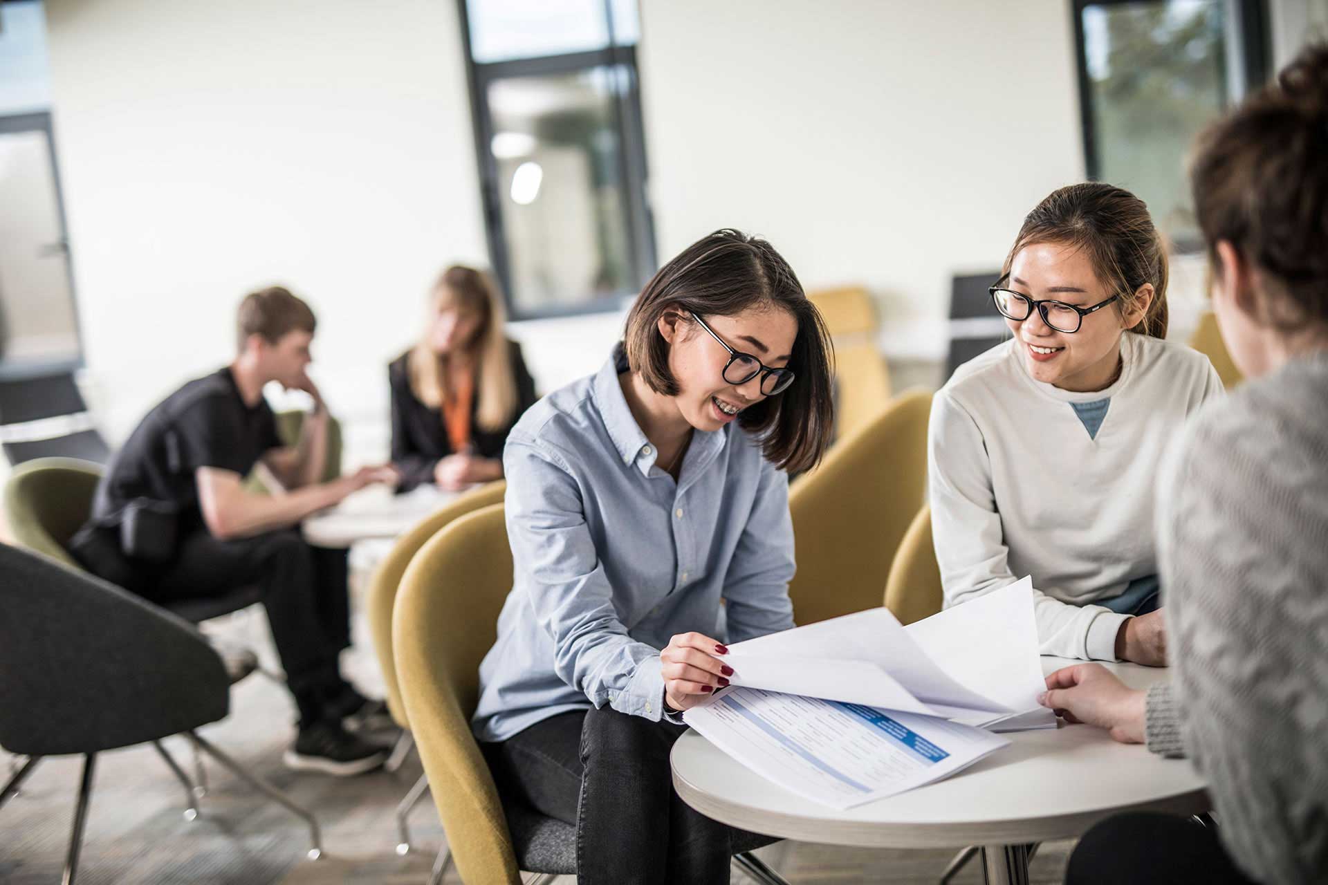 Students working at a breakout table